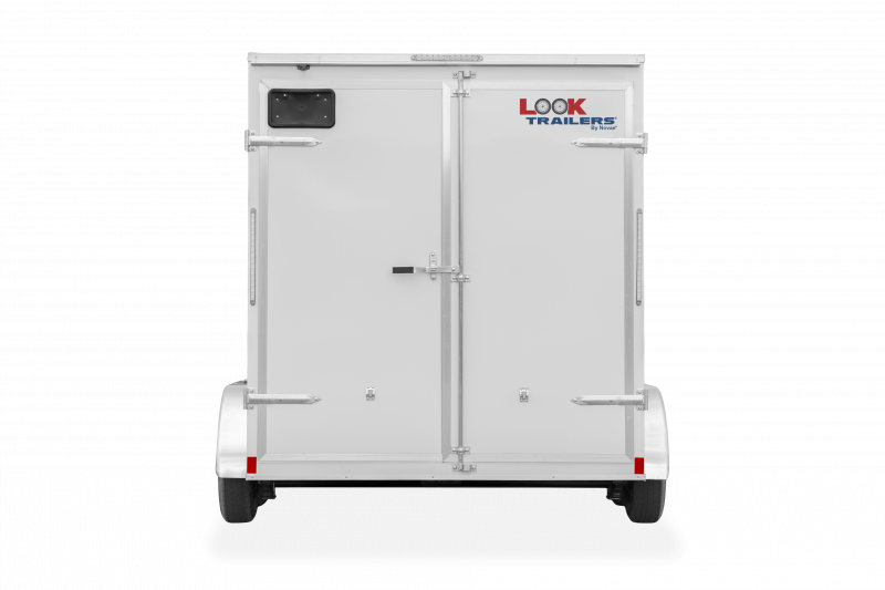 Look Trailers | Trailers | Trailer Models | ST DLX | Image of white enclosed cargo trailer with dual axles showing the back of trailer with rear double door and a clear background | Image 9